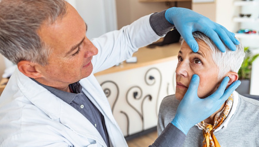 eye doctor performing preventive eye care on a patient